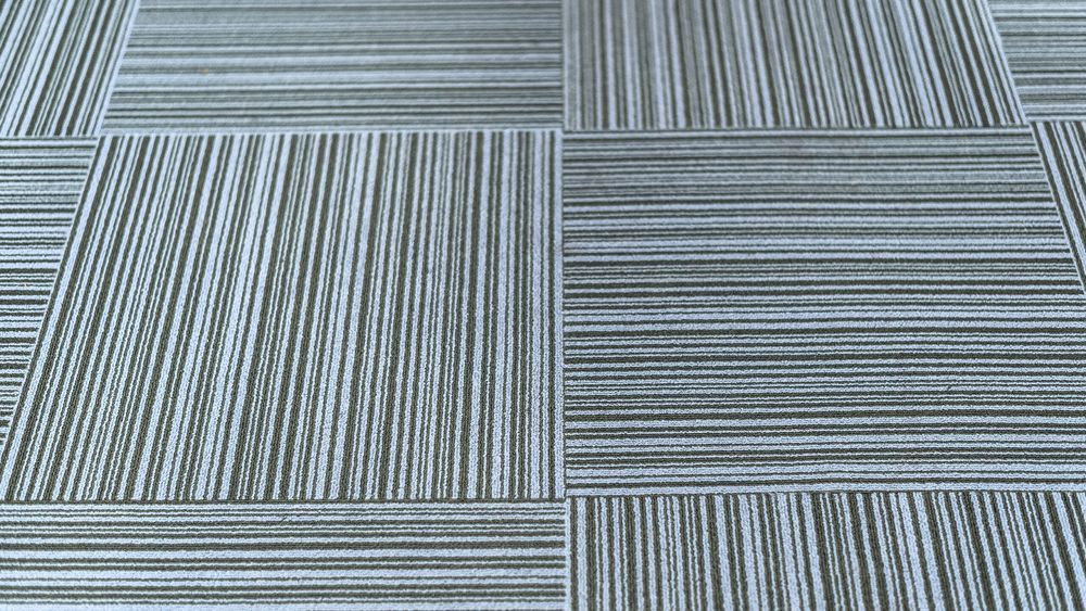 A set of carpet tiles covering a floor.