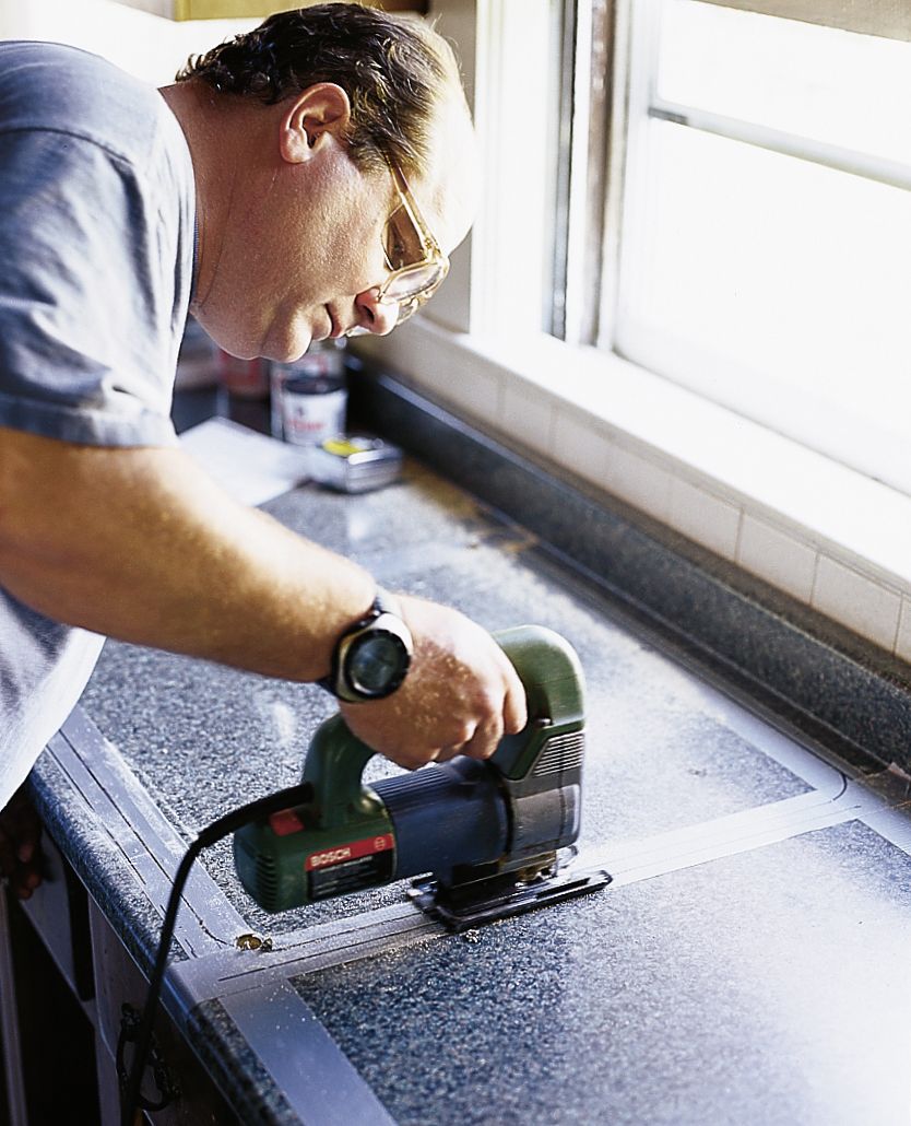 image of cutting a place for a sink using a jigsaw